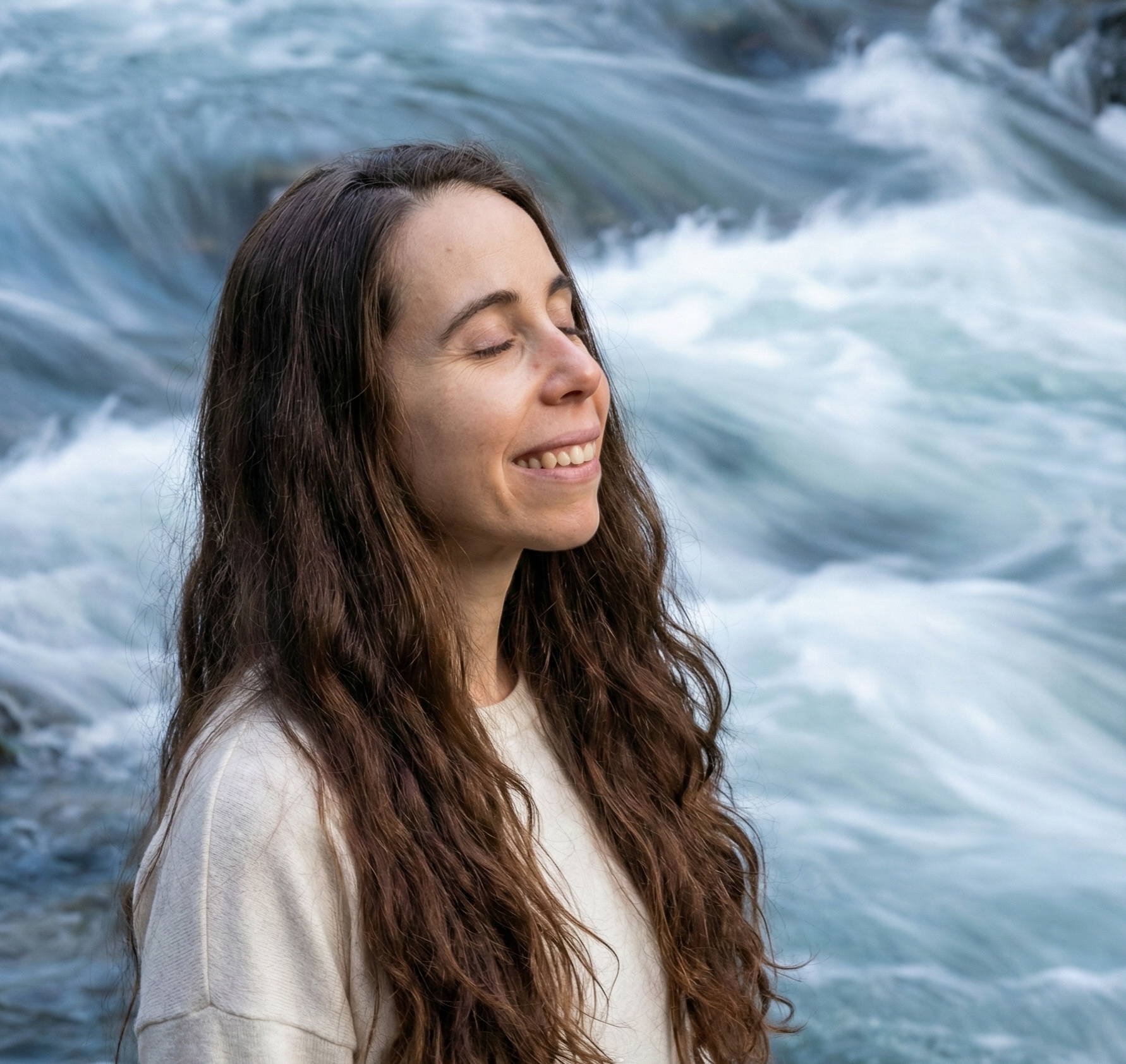Maria House smiling by a waterfall